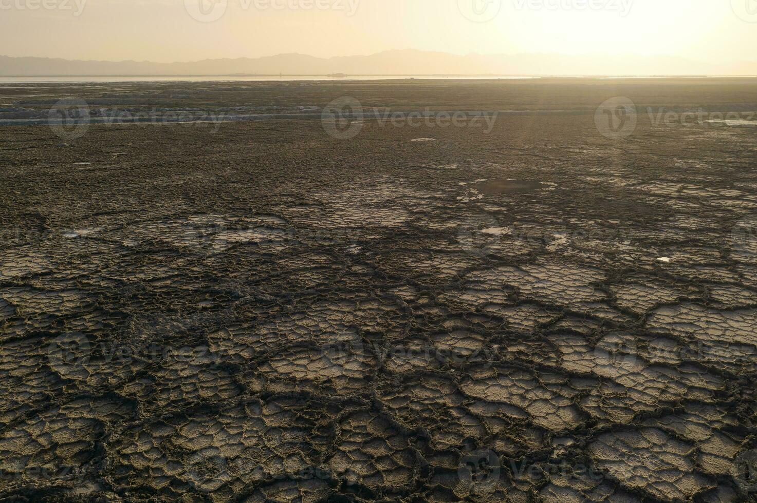 The dry land, the soil by the salt lake in Qinghai, China. photo