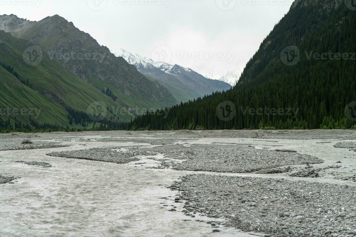 River and mountains with white clouds. photo