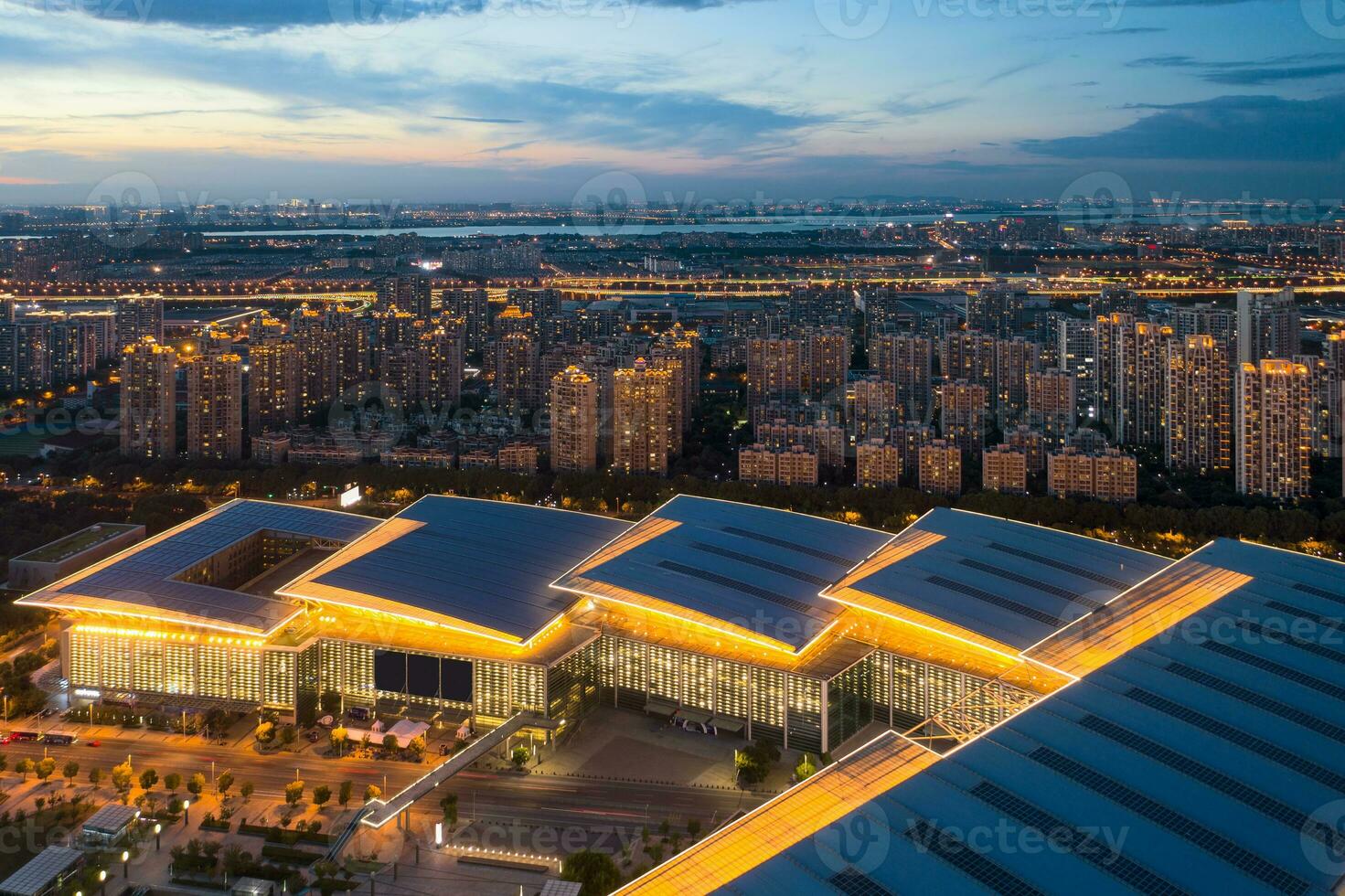 Illuminated residence buildings at night in Suzhou, China. photo