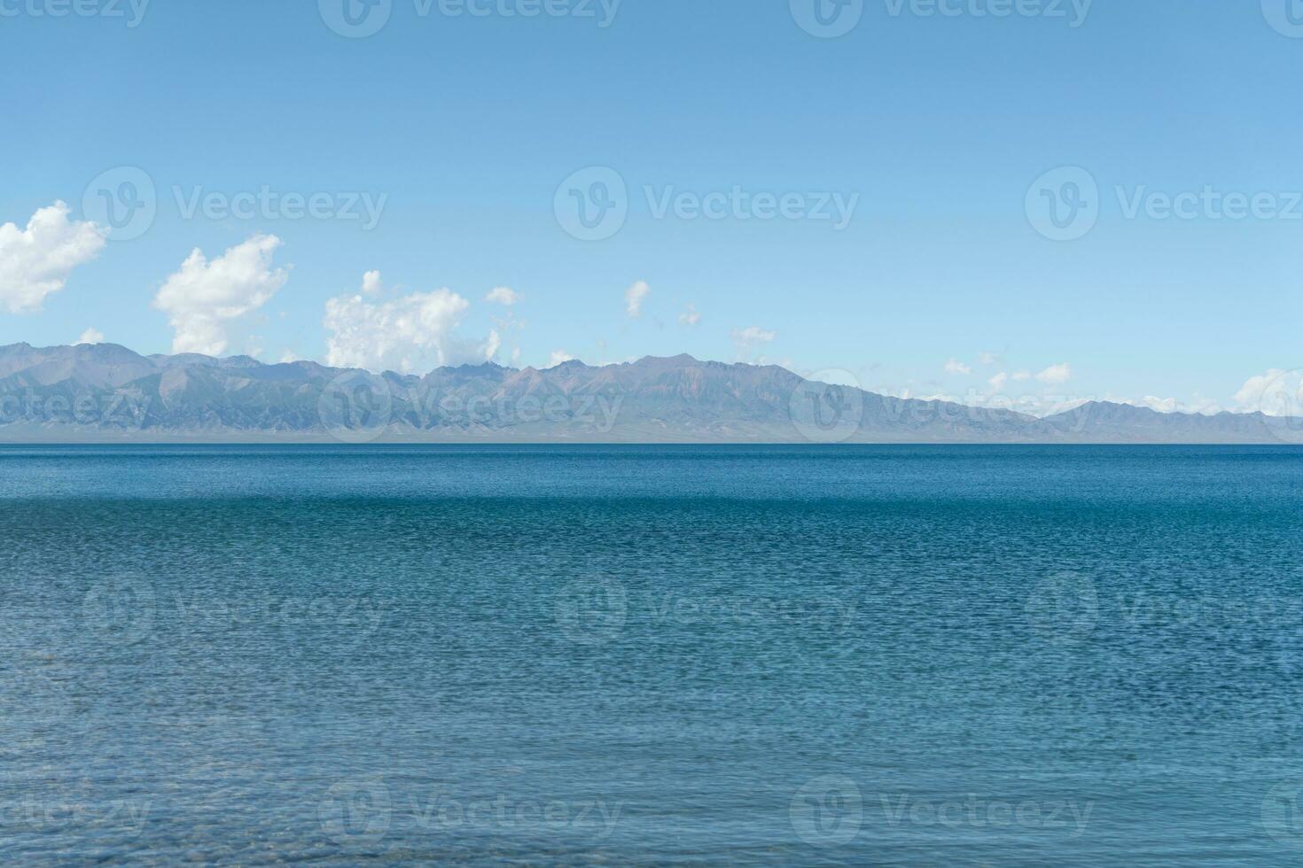 Calm surface of the lake with a sunny day. Shot in Sayram Lake in Xinjiang, China. photo