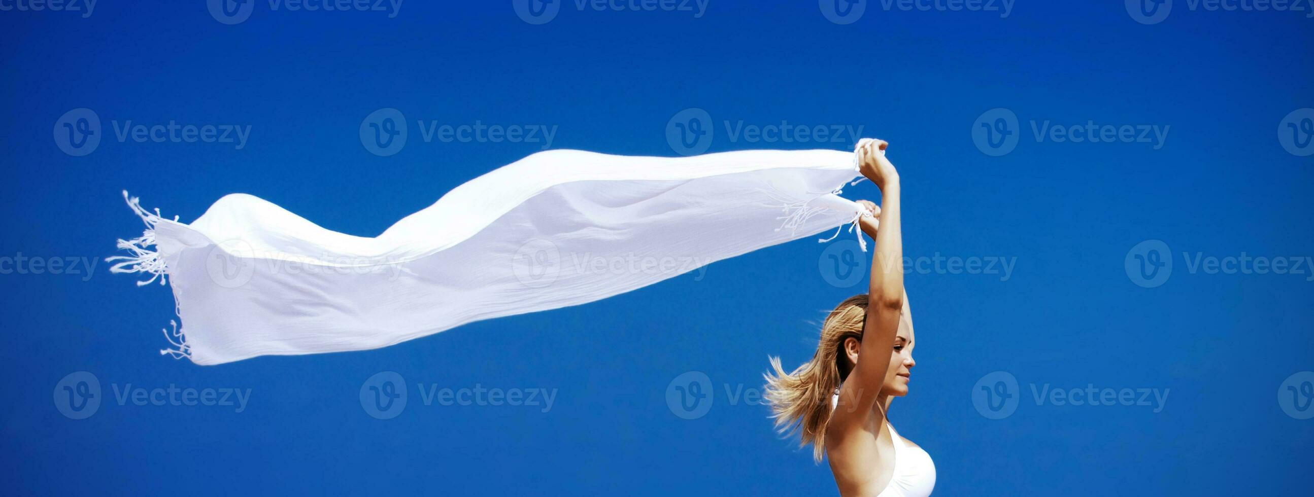 Female enjoying wind over sky photo