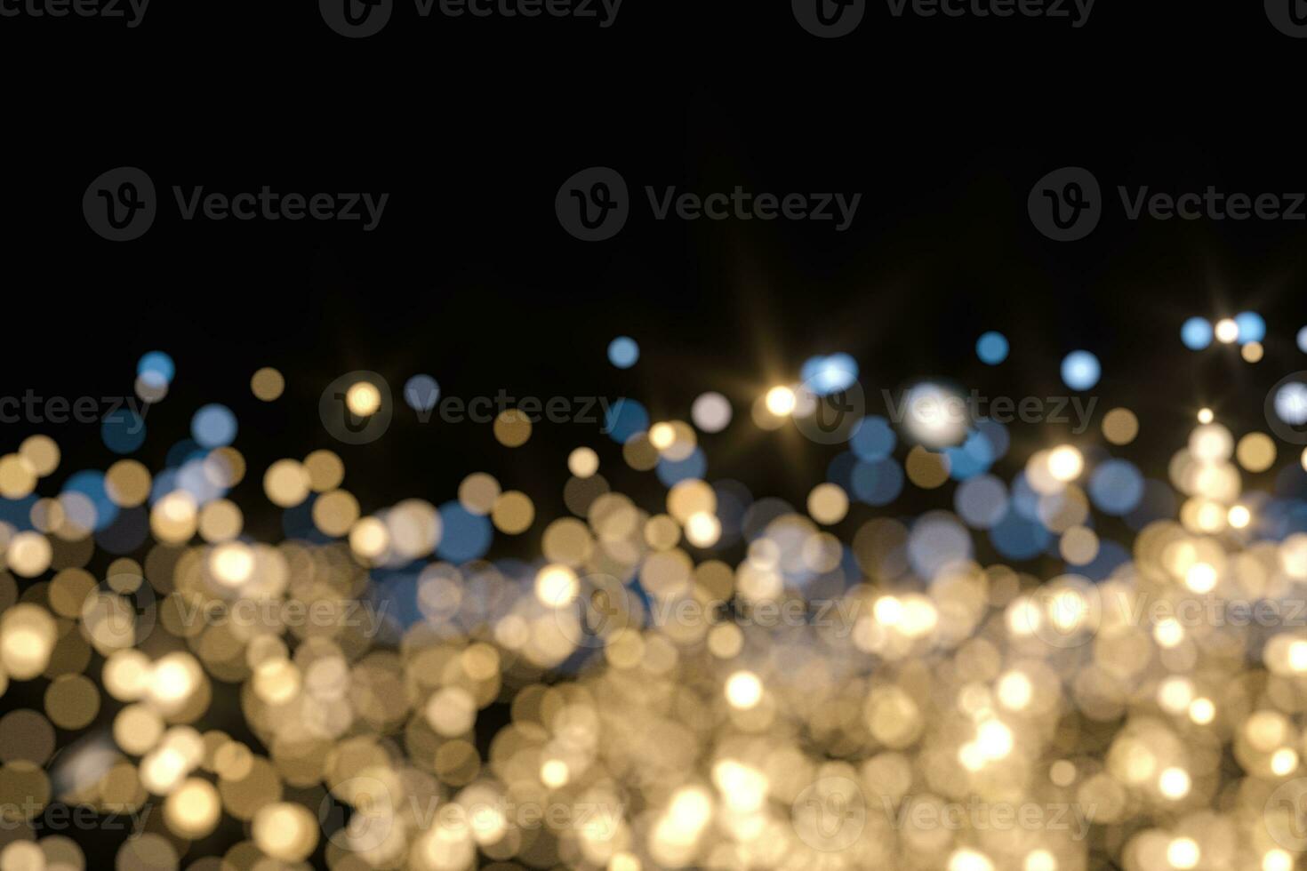 Floating specks of light on black background, 3d rendering. photo