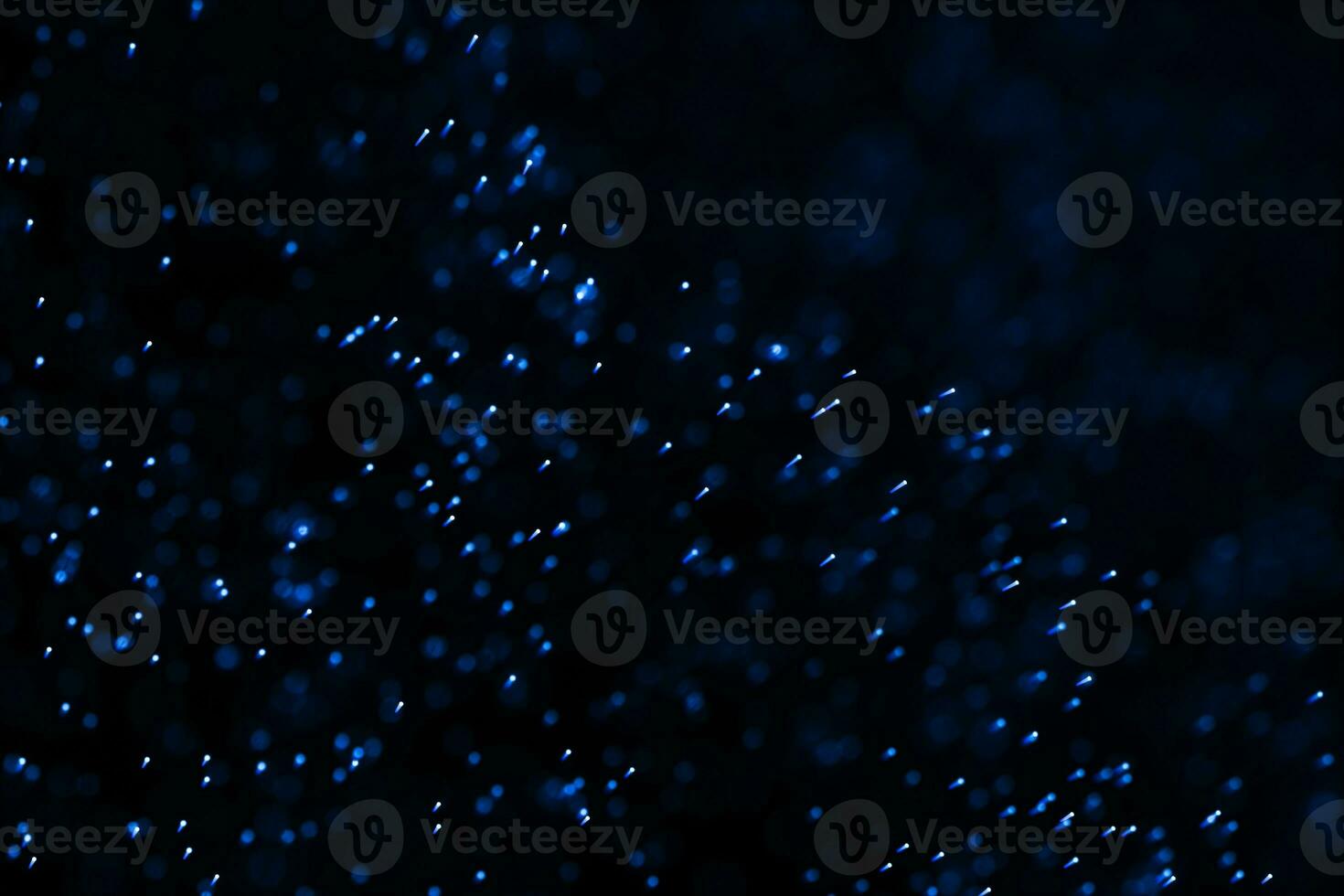 Flowing and glowing particles with dark background, 3d rendering photo