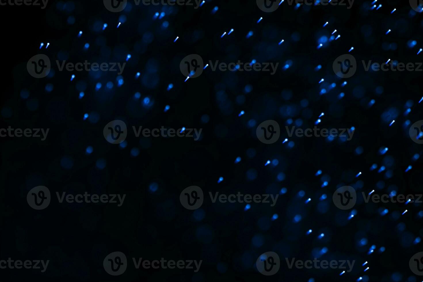 Flowing and glowing particles with dark background, 3d rendering photo
