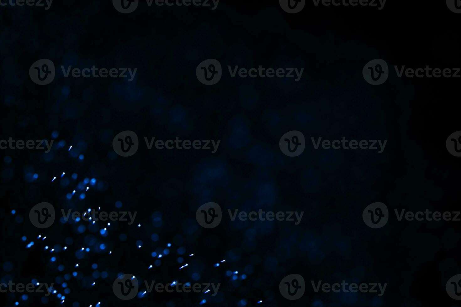 Flowing and glowing particles with dark background, 3d rendering photo