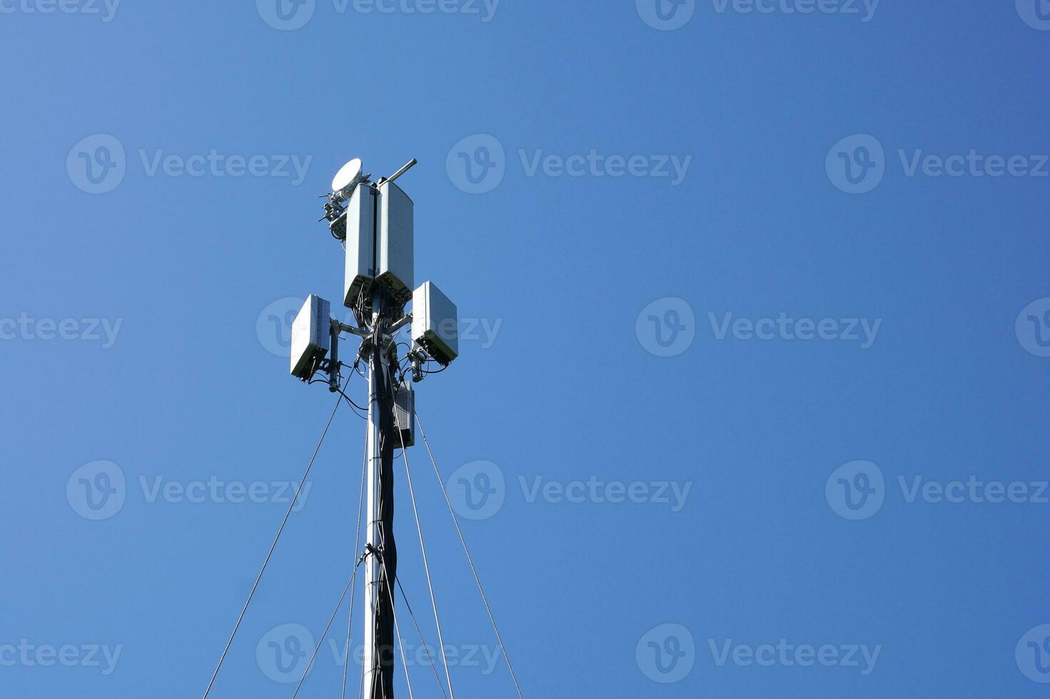 mobile cell tower against blue sky photo