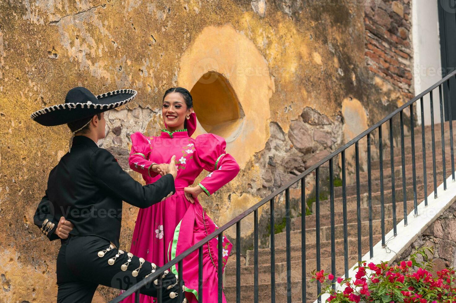 young hispanic woman and man in independence day or cinco de mayo parade or cultural Festival photo