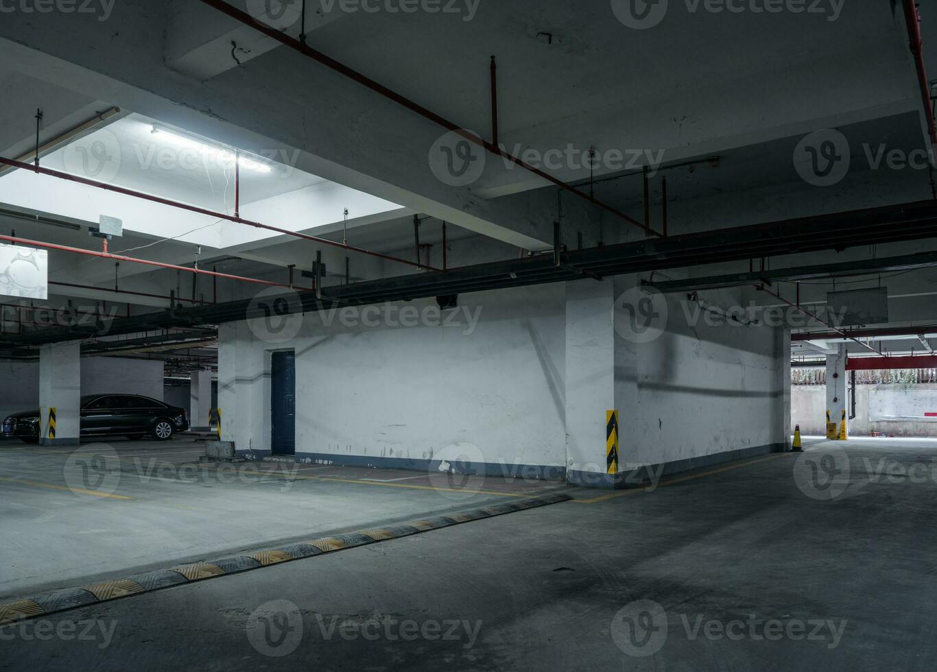 old parking lot with lighting, concrete building photo