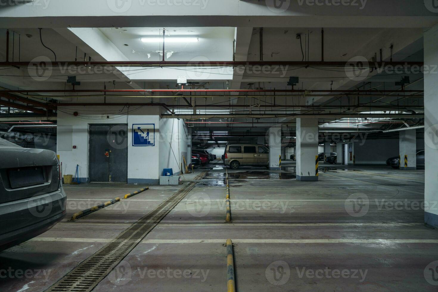 old parking lot with lighting, concrete building photo