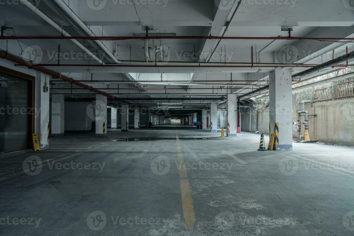 old parking lot with lighting, concrete building photo