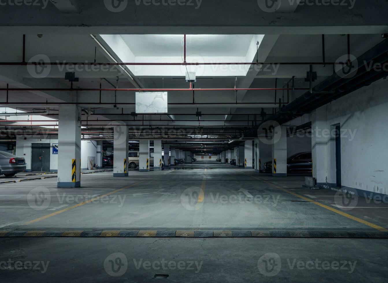 old parking lot with lighting, concrete building photo