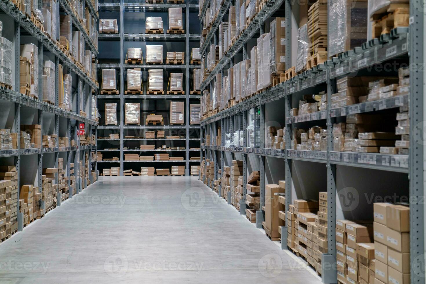 The warehouse full of goods, boxes and shelves photo