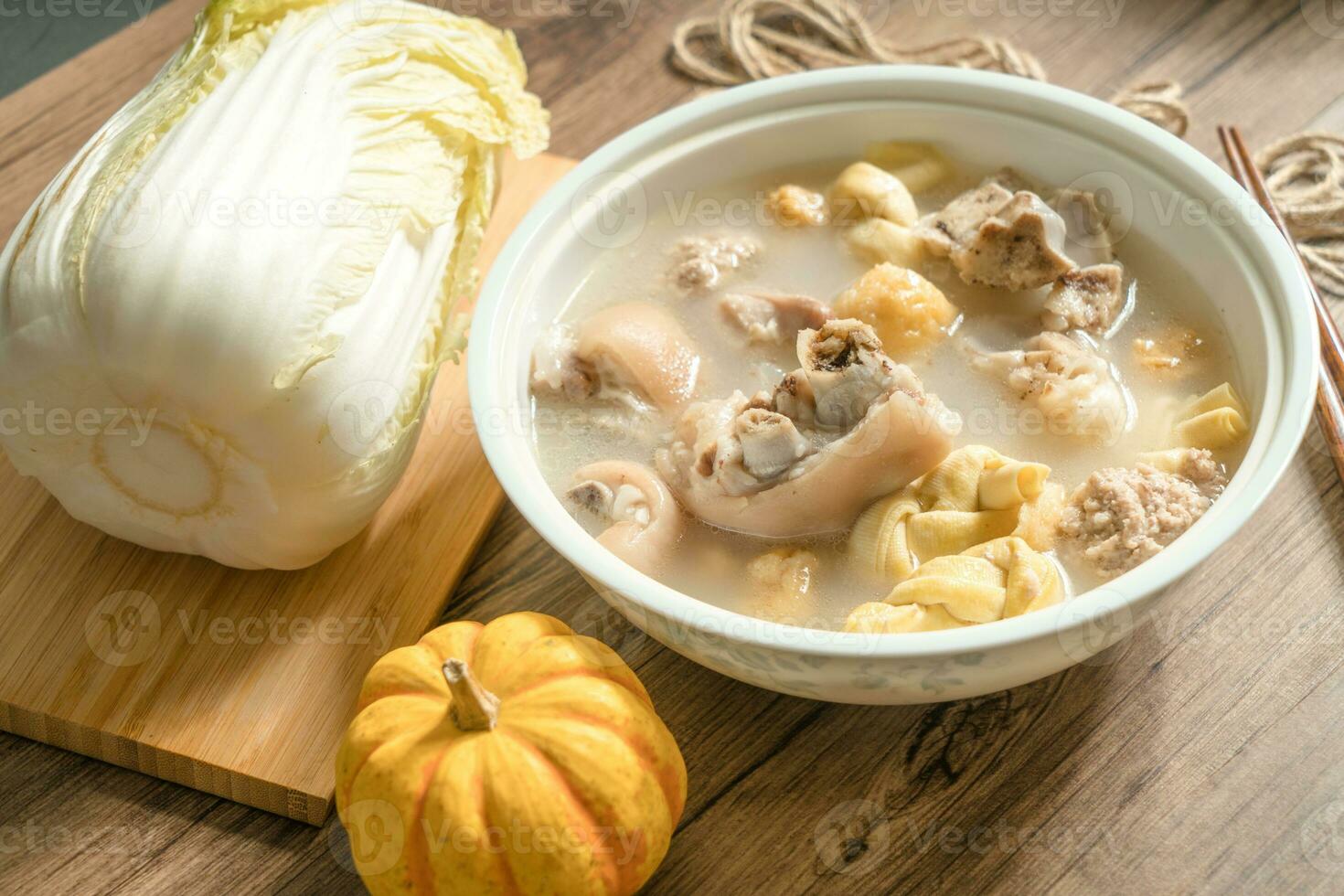trotter soup with wooden background photo