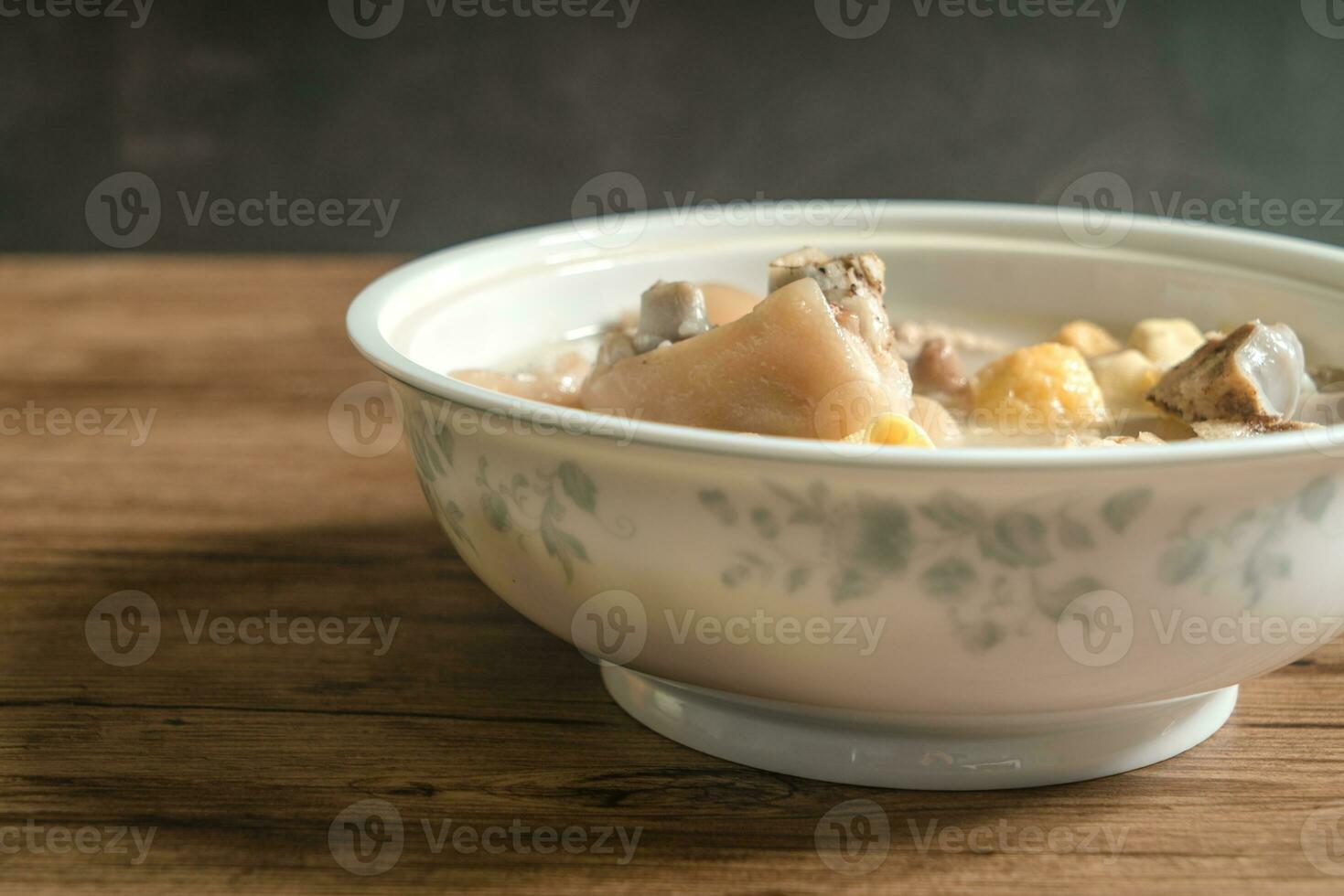 trotter soup with wooden background photo