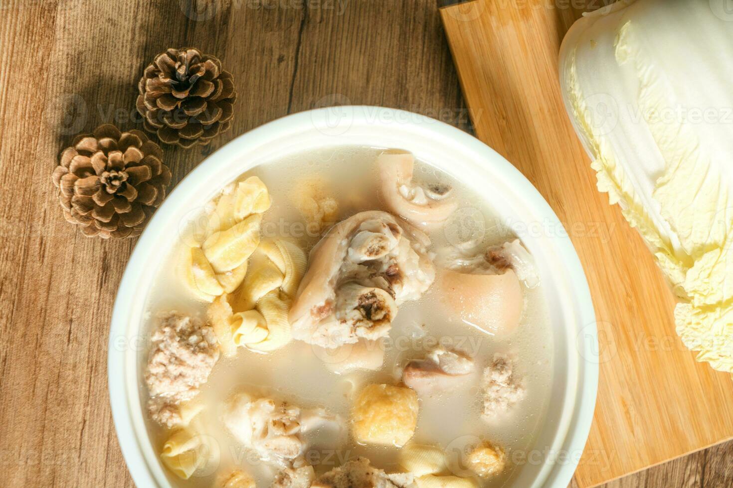 trotter soup with wooden background photo