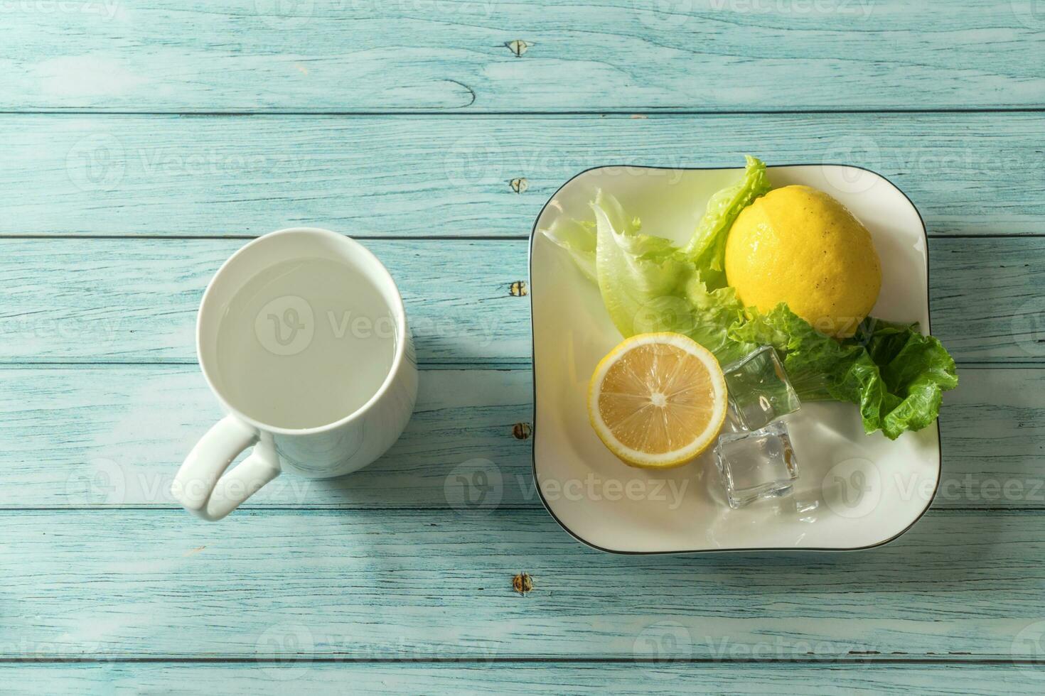 the fruit lemon on the blue table, cool light background photo