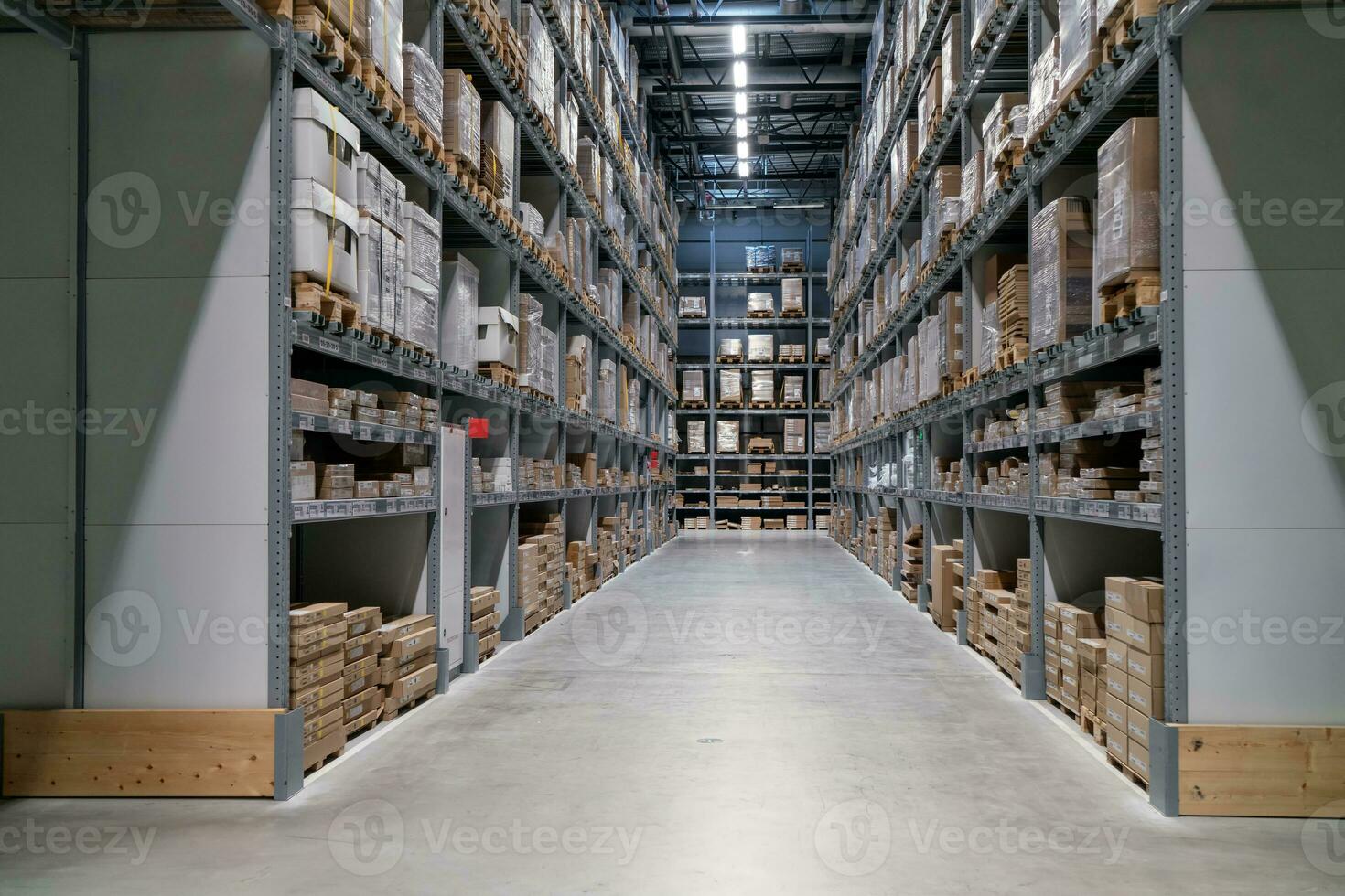 The warehouse full of goods, boxes and shelves photo