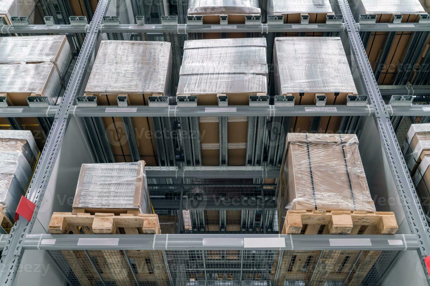 The warehouse full of goods, boxes and shelves photo