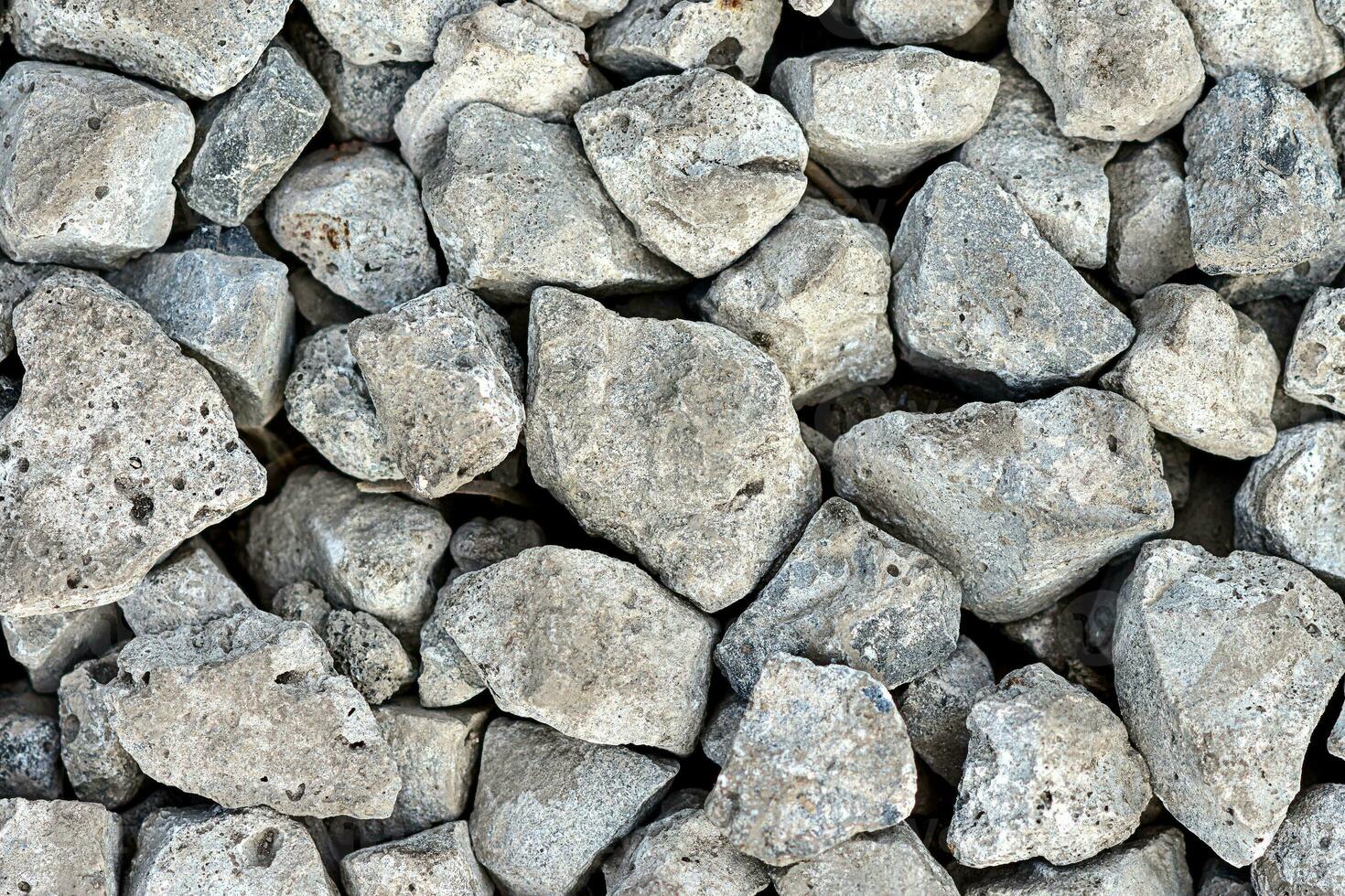 Grey stone texture for background. Pattern with rocks or gravel photo