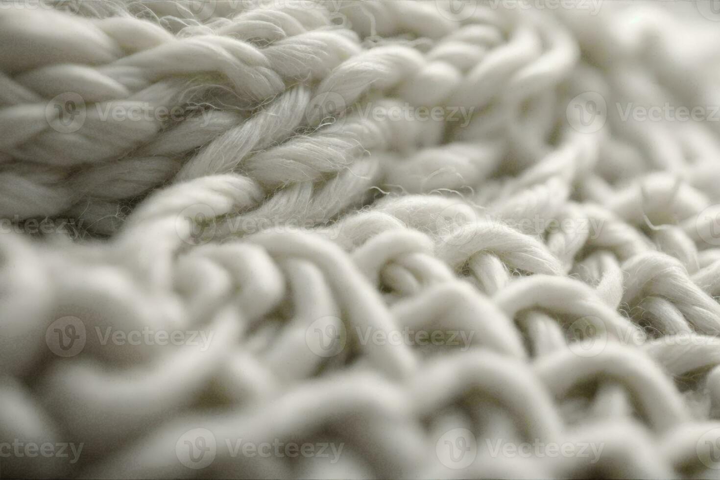 white woolen yarn, showcasing its intricate texture and softness. The yarn is tightly twisted and coiled. photo