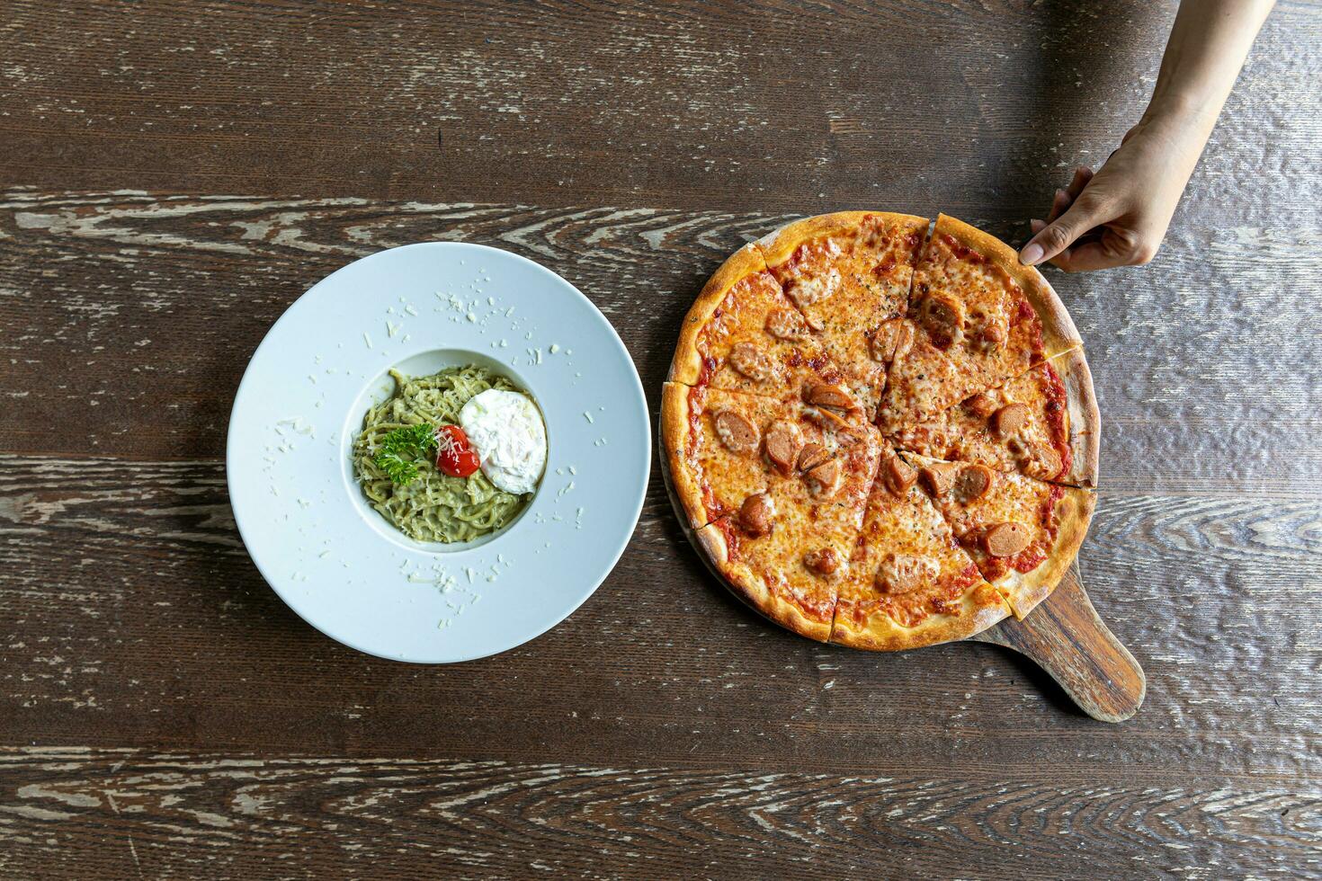 spaghetti carbonara with onset egg and  pizza photo