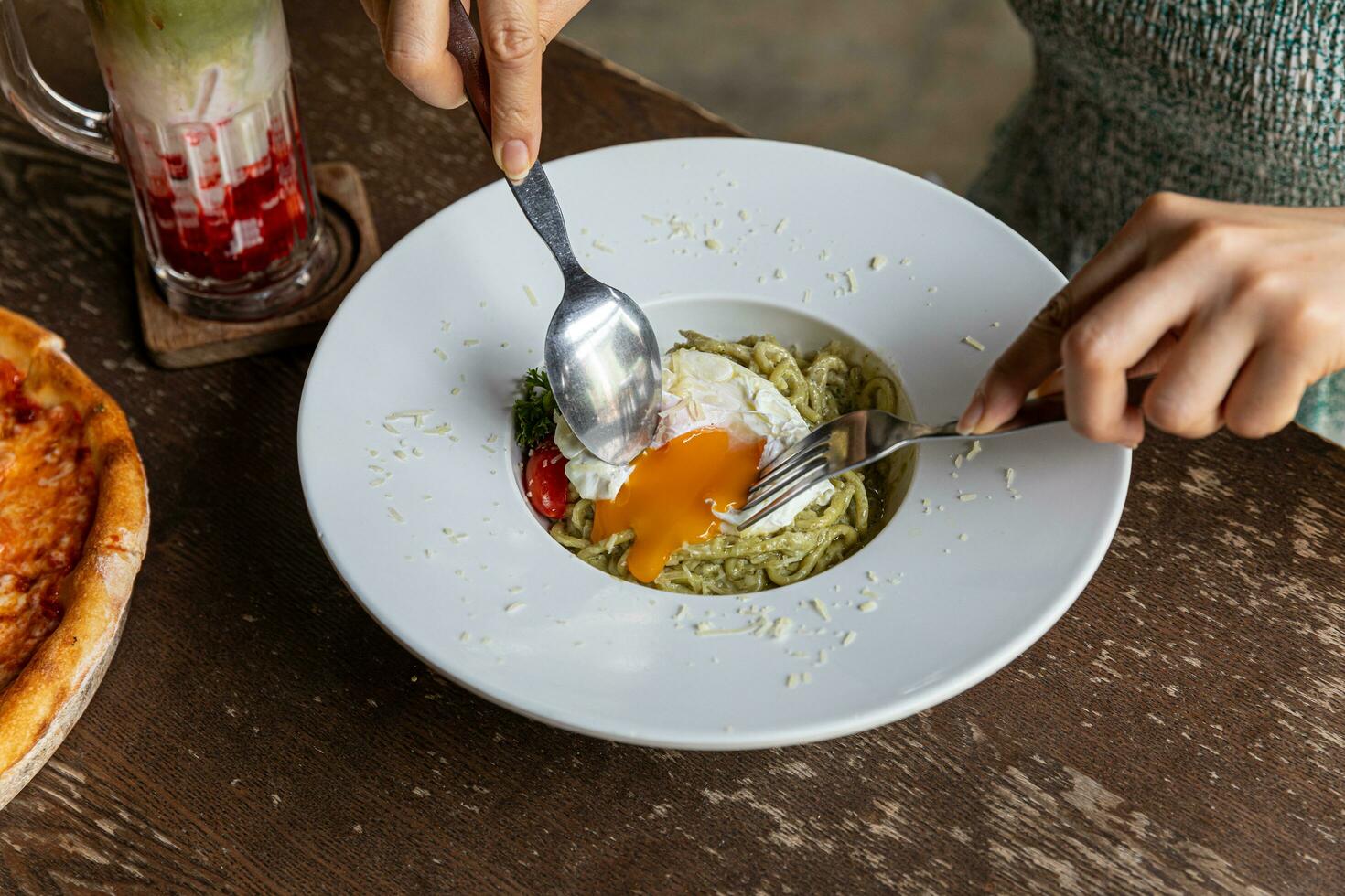 Pasta spaghetti with pesto sauce in bowl. Light grey background.Top view. Egg and bacon spaghetti carbonara. photo