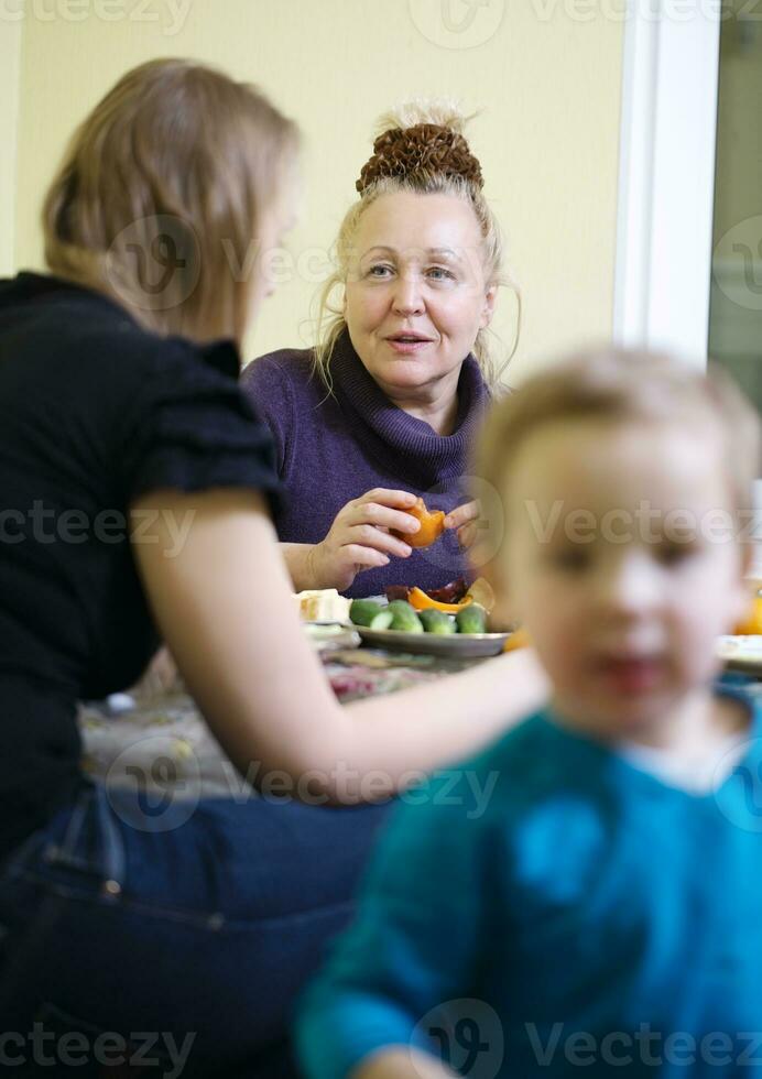 Elderly mother and daughter enjoying a meal photo