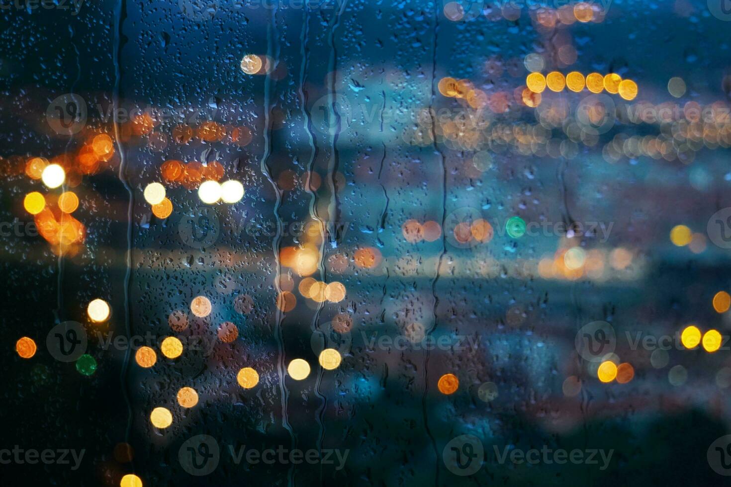 raindrops on the window and Bilbao city background photo