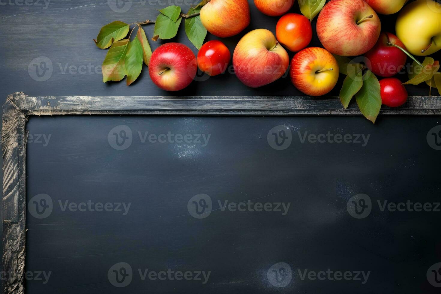 Still Life Photography of a rustic blackboard adorned with an artful arrangement of various fruits and leaves. photo