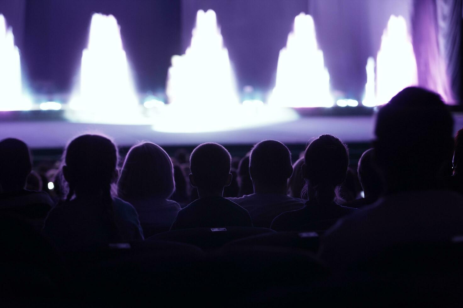 Audience watching a live performance photo