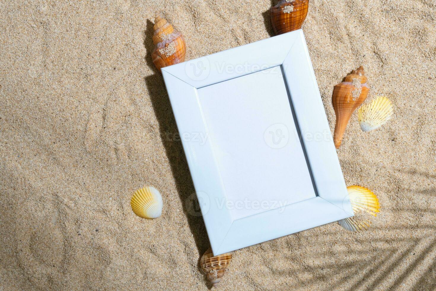 White frame mockup on top of sand background photo