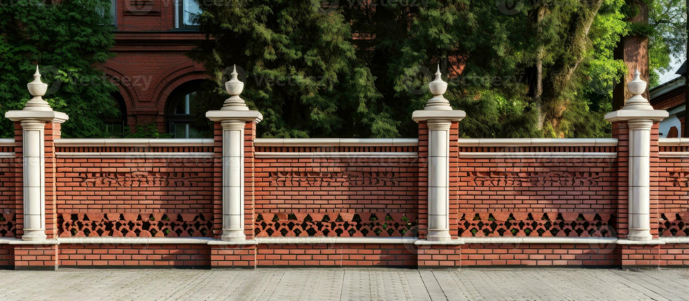 Red brick fence with modern decorative columns photo