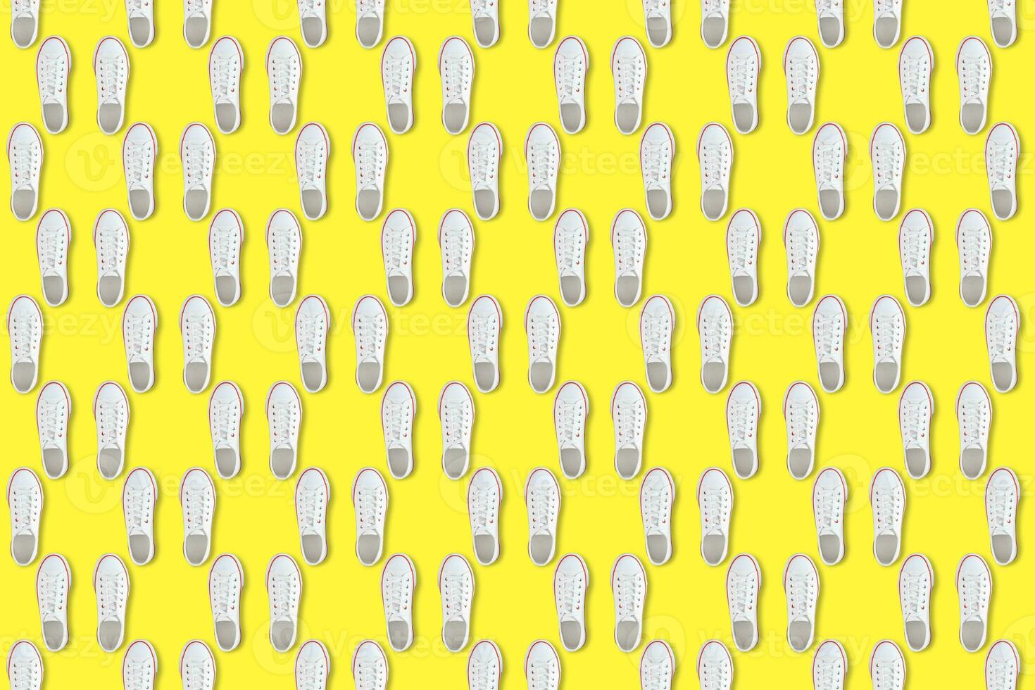 White sneakers on yellow background, Seamless pattern photo