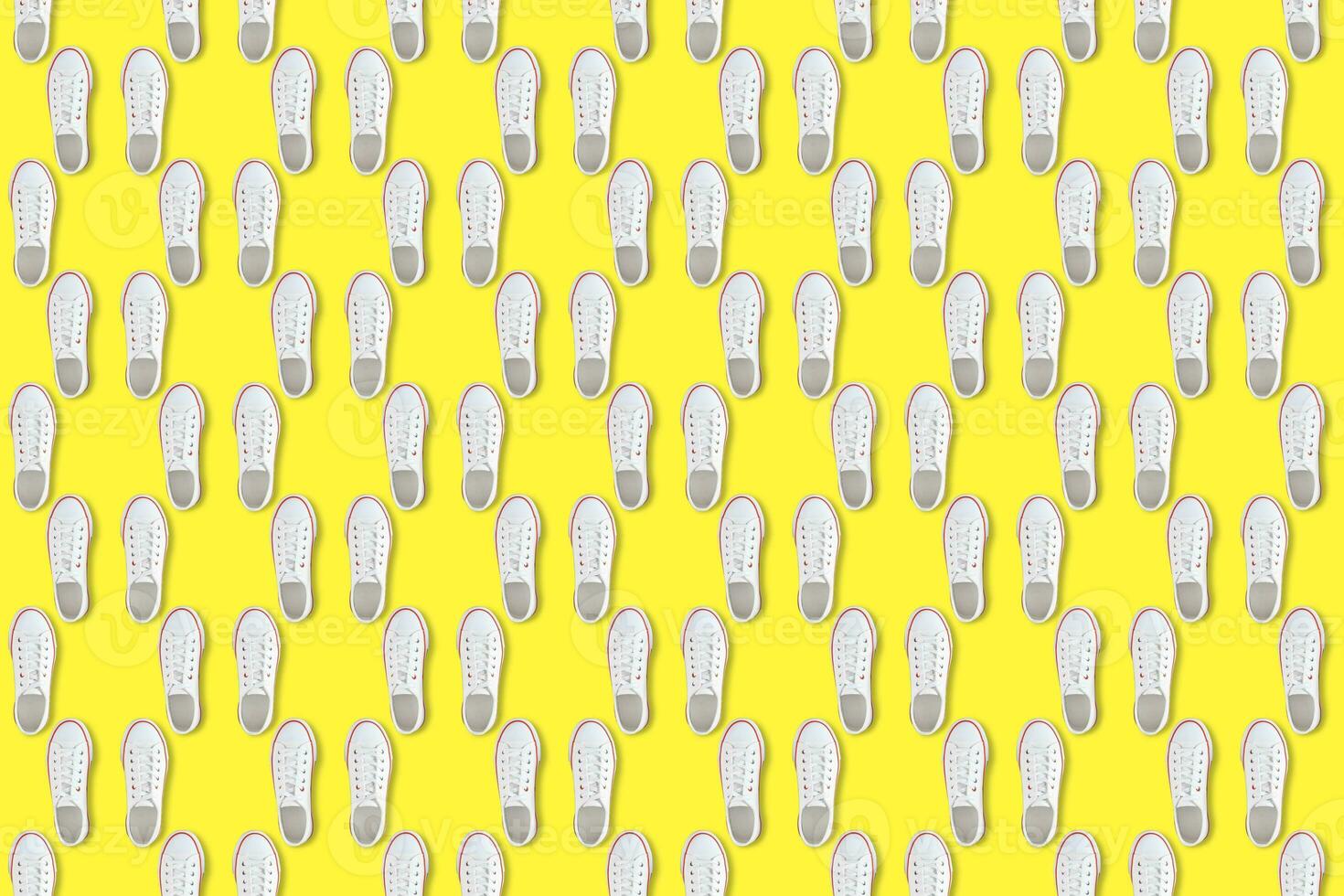 White sneakers on yellow background, Seamless pattern photo