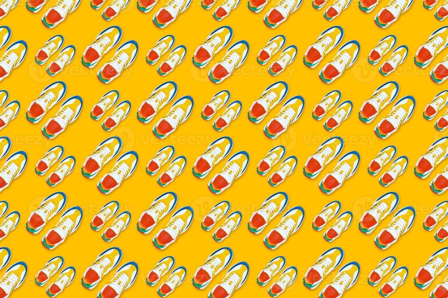 Colorful sneakers on yellow background, Seamless pattern photo