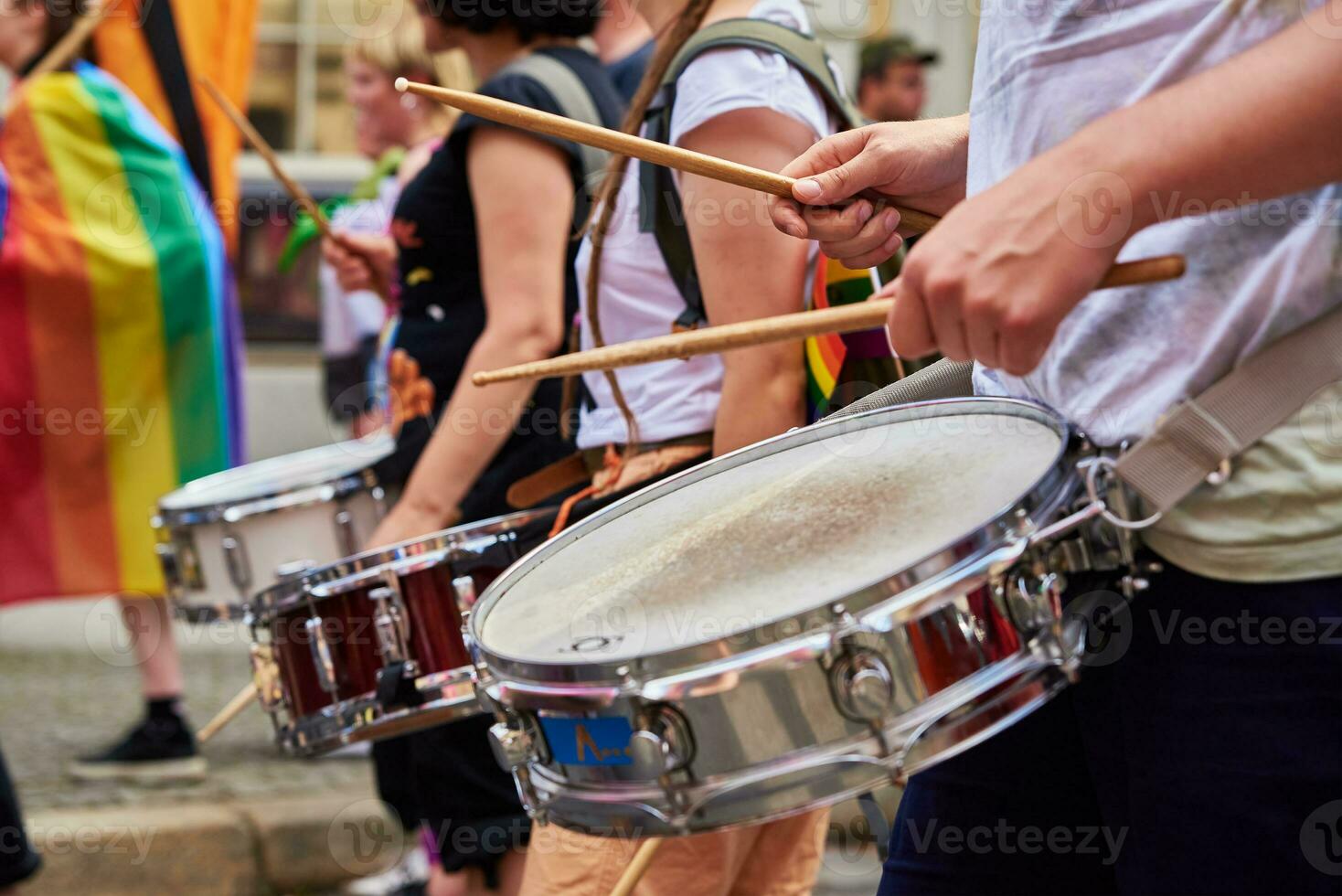 People with drums in street at demonstration in city photo