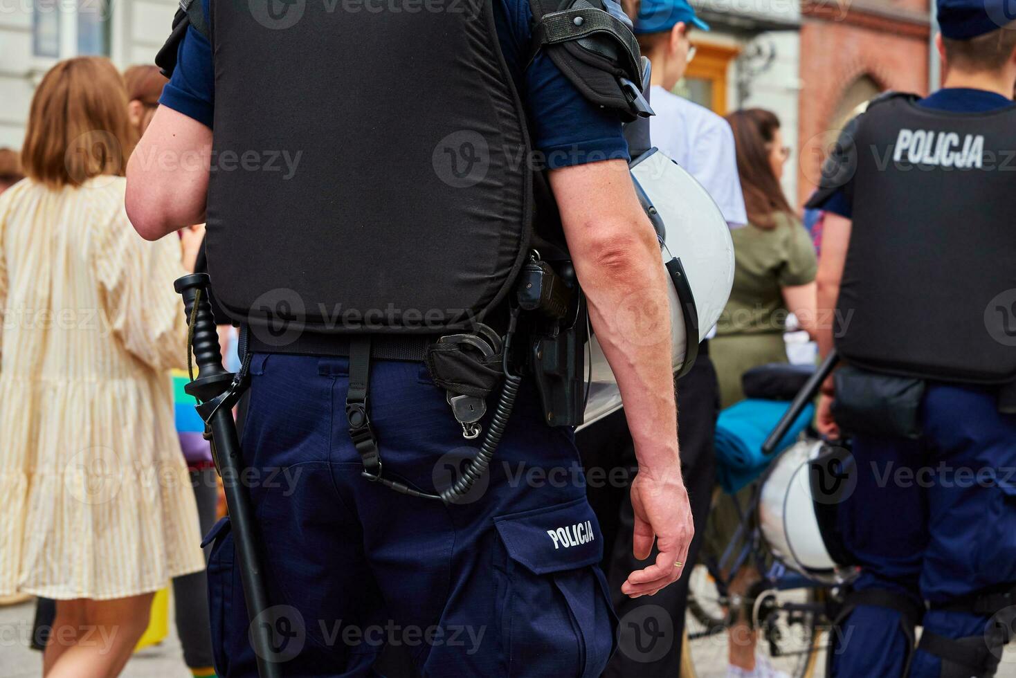 Police guard crowd of people at demonstration in Poland photo