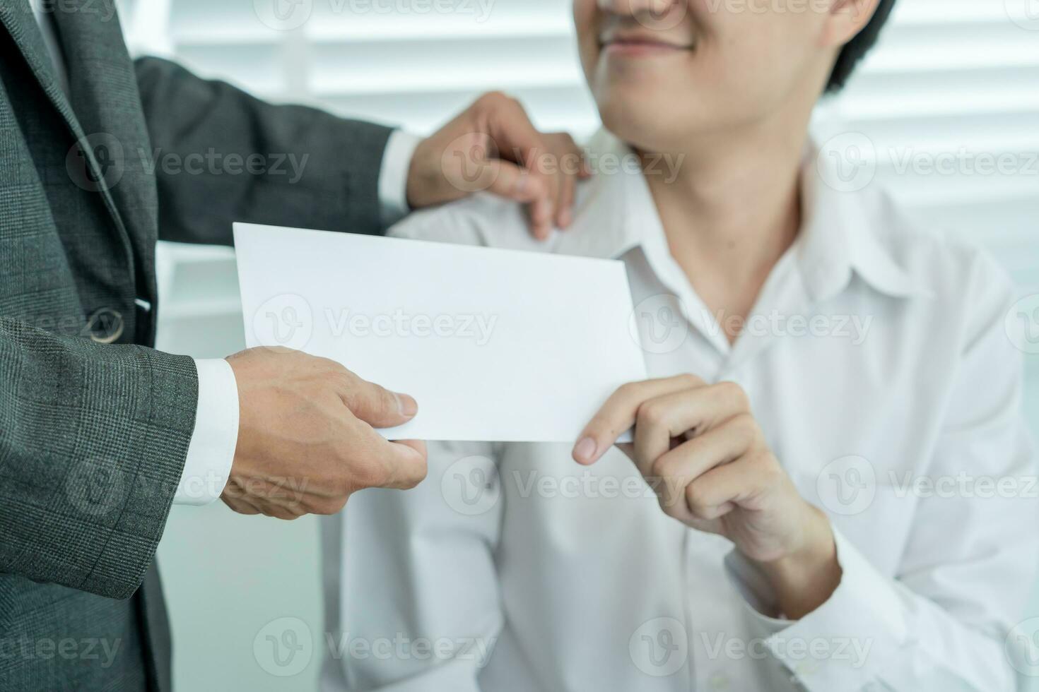 Businessmen receive salary or bonuses from management or Boss. Company give rewards to encourage work. Smiling businessman enjoying a reward at the desk in the office. photo