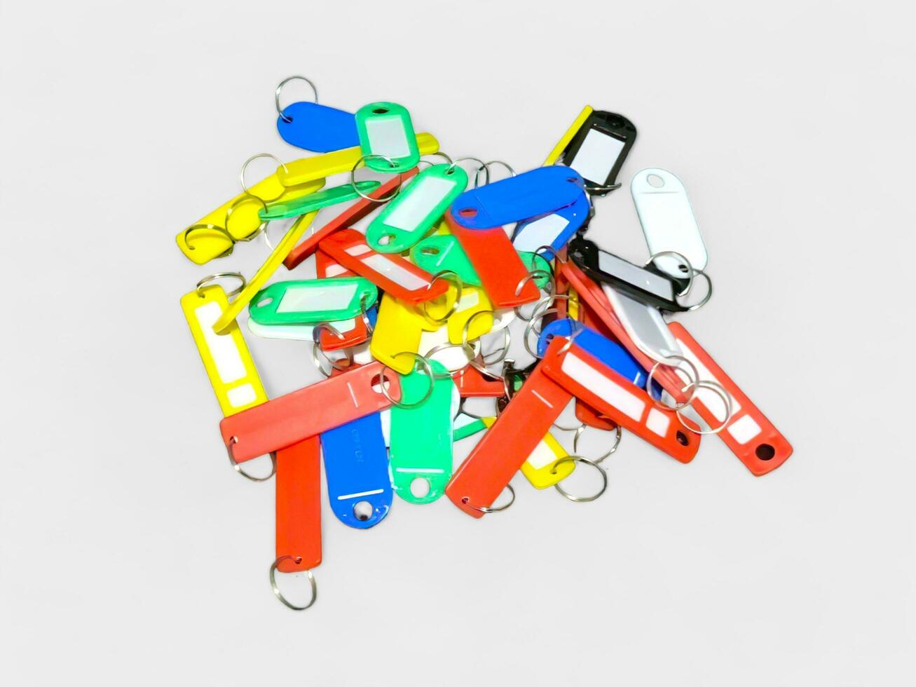 Colorful id tag hangers made of plastic on a white background photo