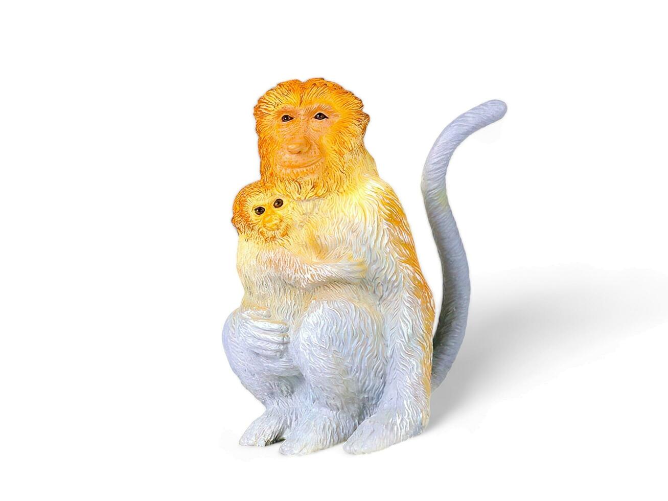 Proboscis monkey with cubs miniature animal on white background photo