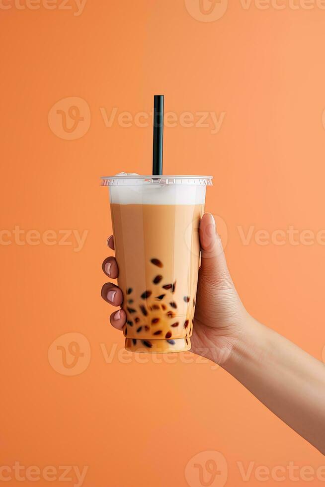 A hand holding takeaway plastic cup of delicious iced bubble milk tea and black pearls. ai generated photo