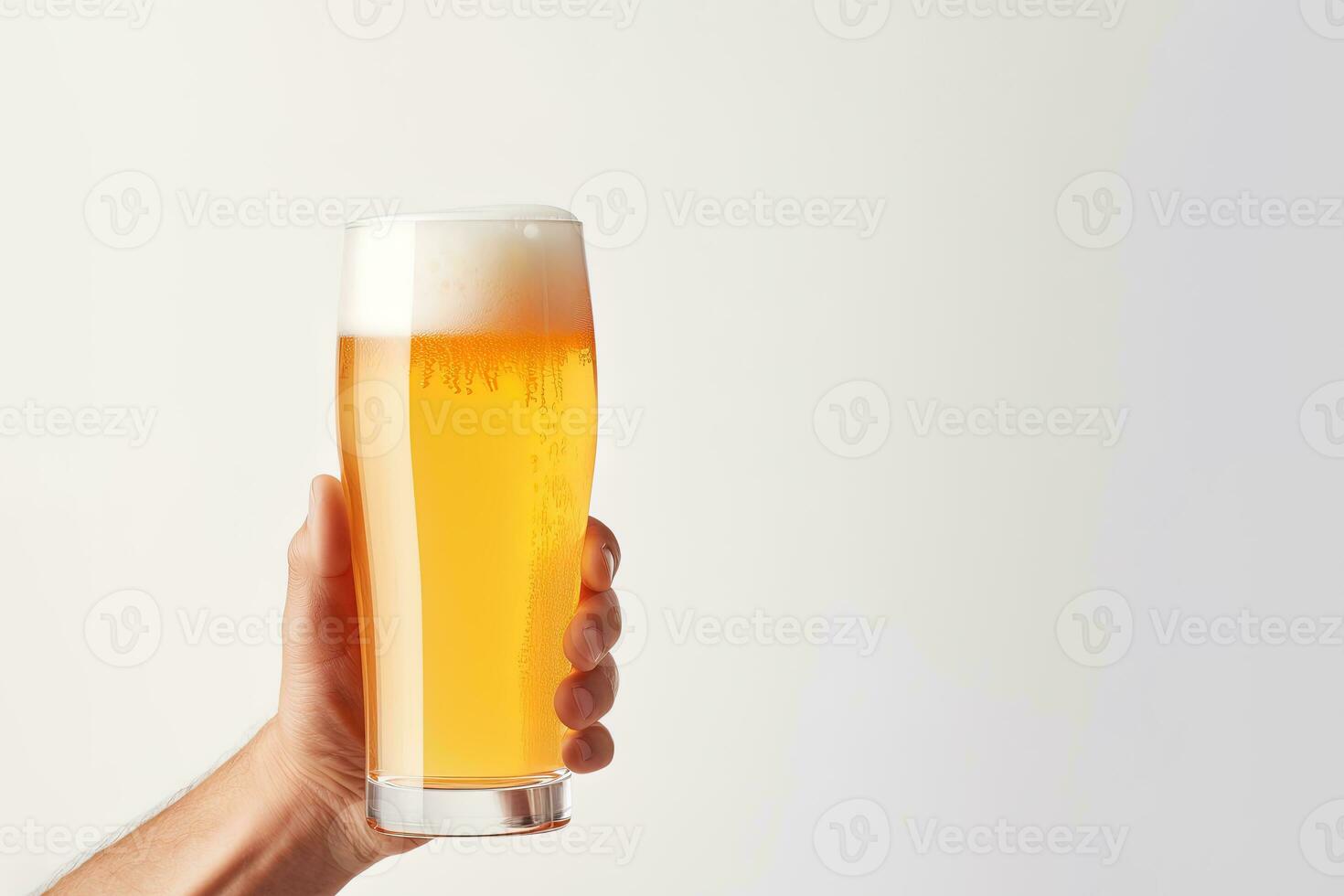 a male hand holding up a glass of beer isolated on a white background with copy space. ai generated photo