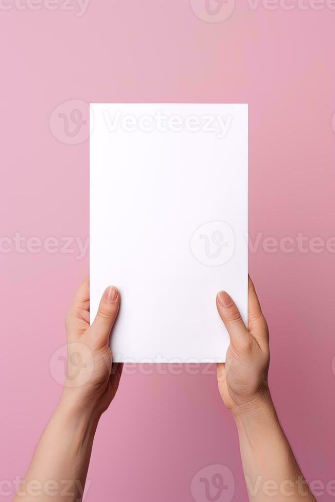 A human hand holding a blank sheet of white paper or card isolated on pink background. ai generated photo