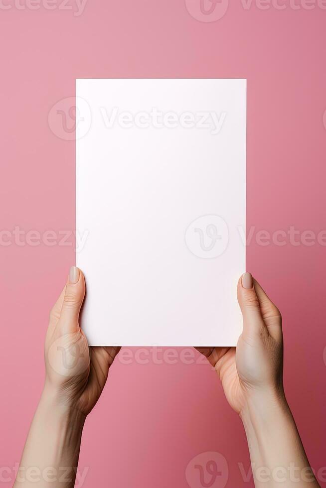 A human hand holding a blank sheet of white paper or card isolated on pink background. ai generated photo
