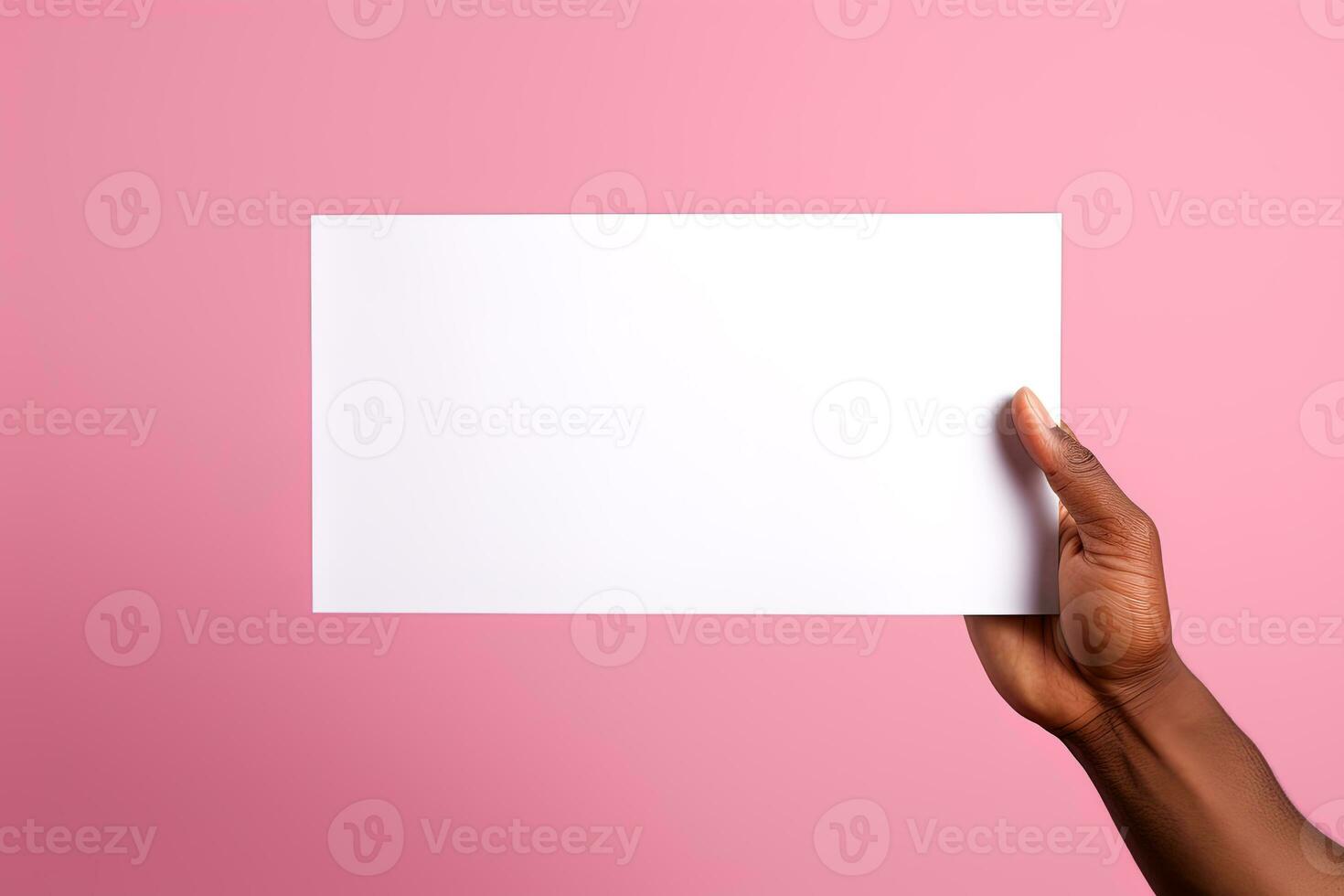 A human hand holding a blank sheet of white paper or card isolated on pink background. ai generated photo