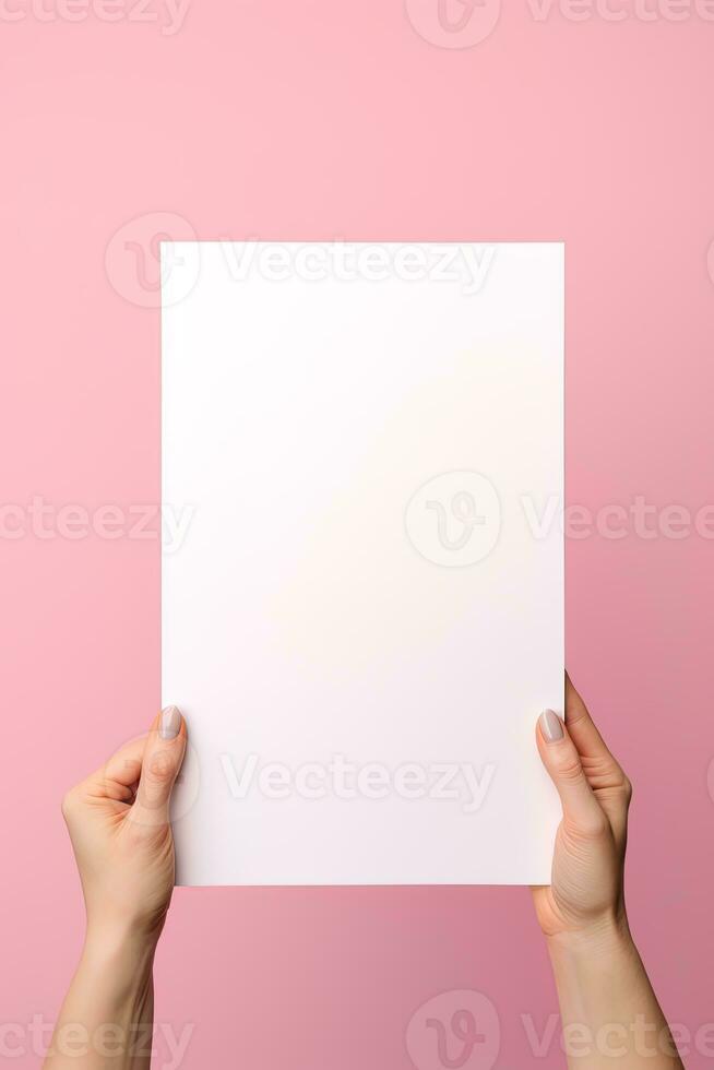 A human hand holding a blank sheet of white paper or card isolated on pink background. ai generated photo