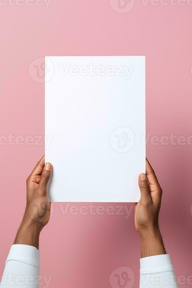 A human hand holding a blank sheet of white paper or card isolated on pink background. ai generated photo