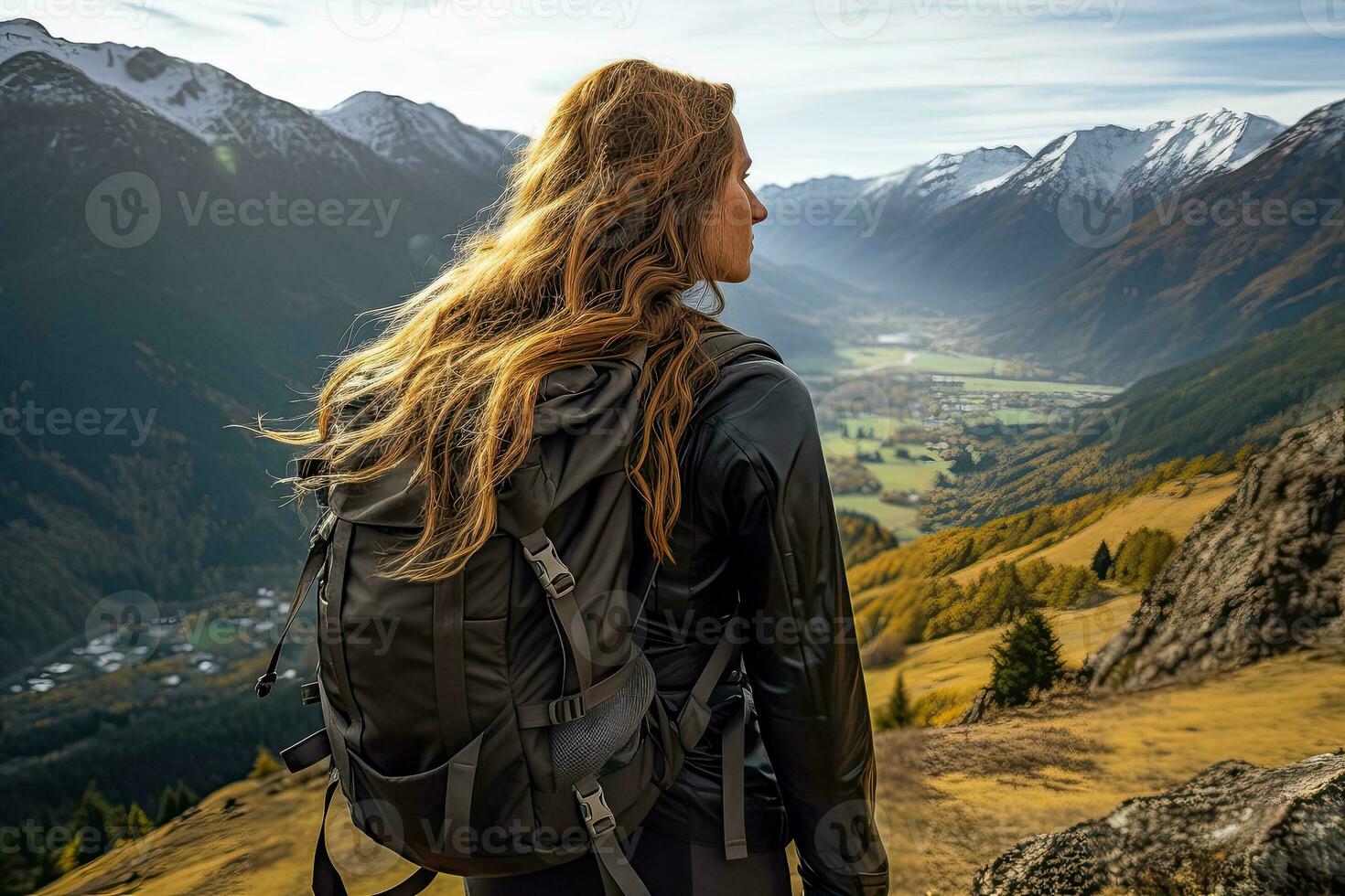 Exploring nature and feeling free while hiking through a stunning mountain landscape with a backpack photo