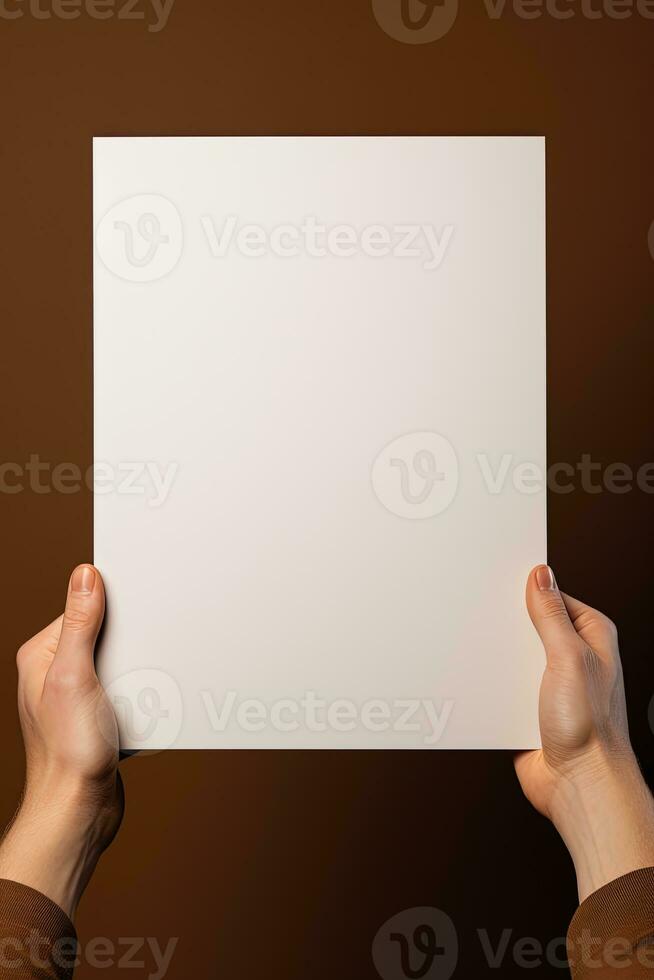 A human hand holding a blank sheet of white paper or card isolated on brown background. ai generated photo