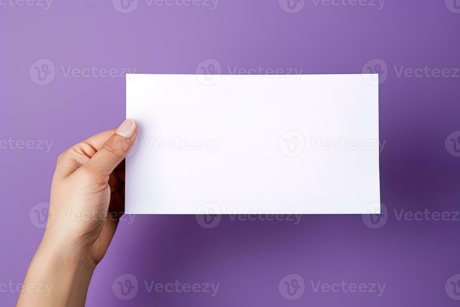 A human hand holding a blank sheet of white paper or card isolated on purple background. ai generated photo